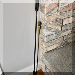 D60. Two iron fireplace tools.